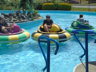 group of adults enjoying bumper boat rides