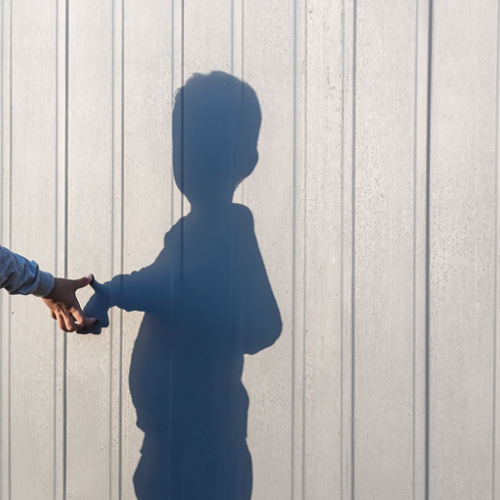 Picture of child looking at his shadow